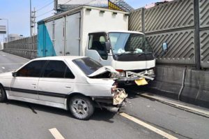 A truck hitting a car