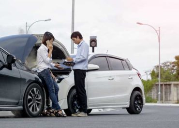 Drivers sharing information after a head-on collision