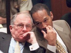 OJ Simpson whispering to F. Lee Bailey
